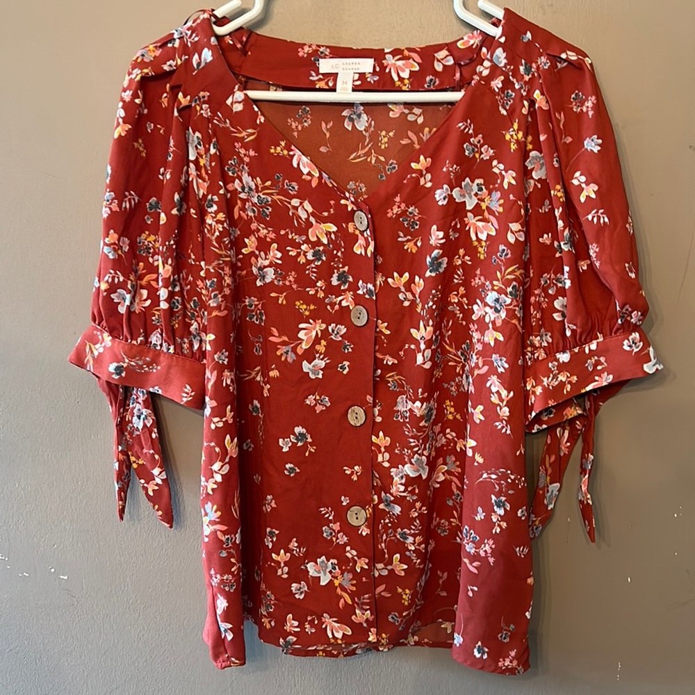 Lauren Conrad blouse in a burnt red with floral design. Size M